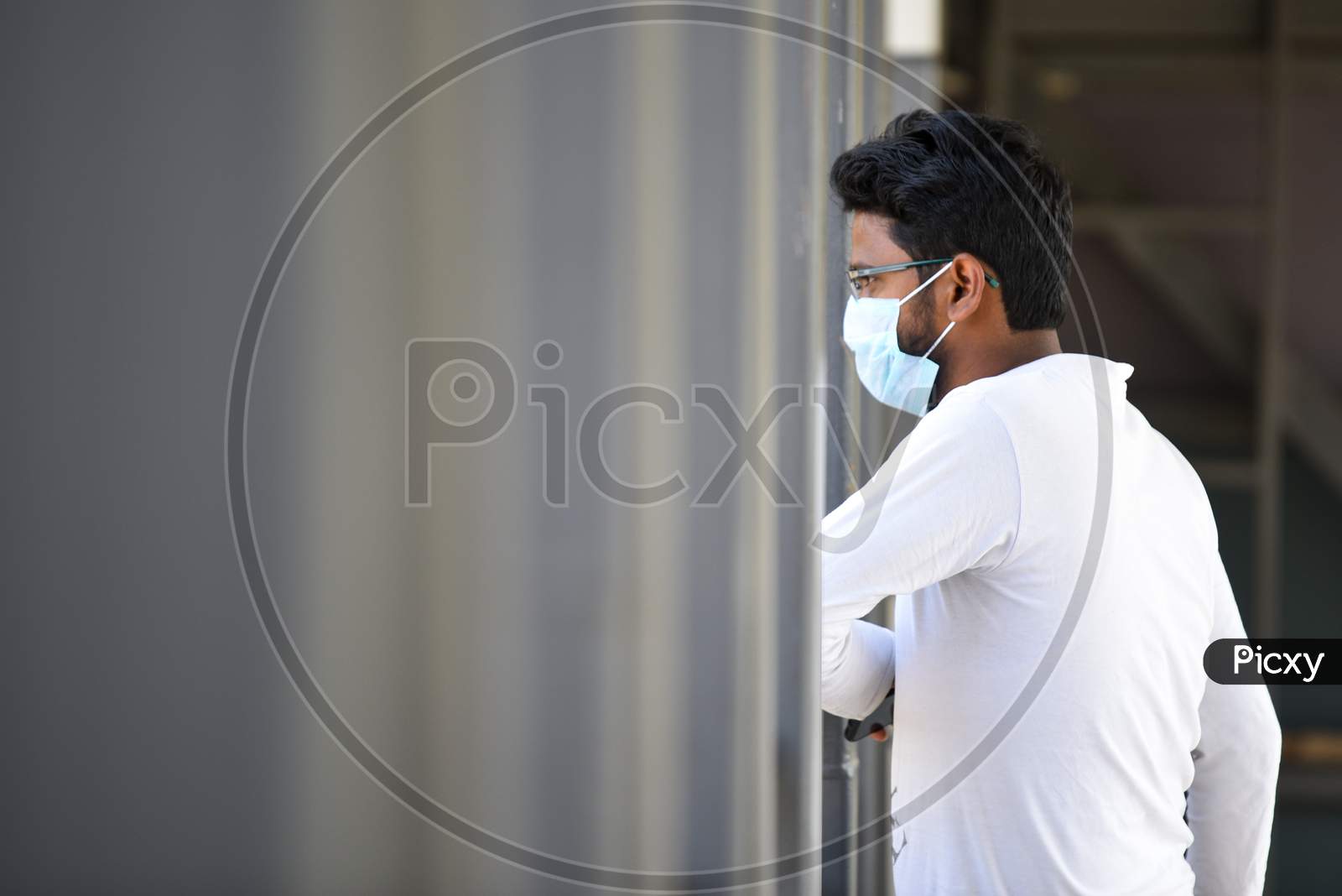 A man wearing the preventive pollution mask on his face to protect himself from Novel Corona Virus, COVID-19