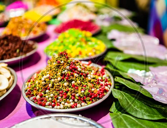 Different Types Of Colorful Garnish Pan Masala Used To Decorate Betel Leaf Banarasi Paan With Selective Focus And Blurred Background.