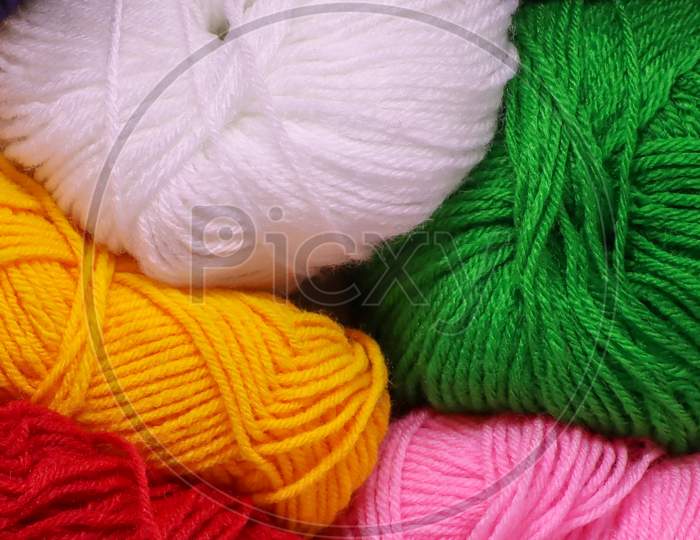 Balls Of Pink Green Red Yellow And White Colored Wool