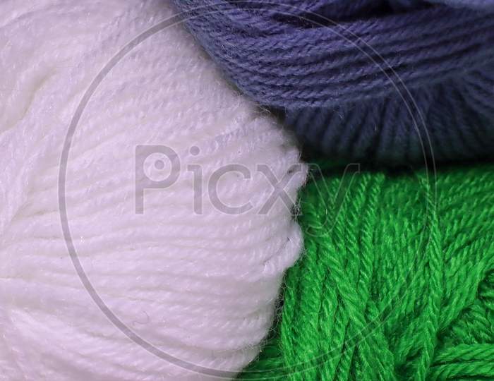 Balls Of Purple Green And White Colored Wool