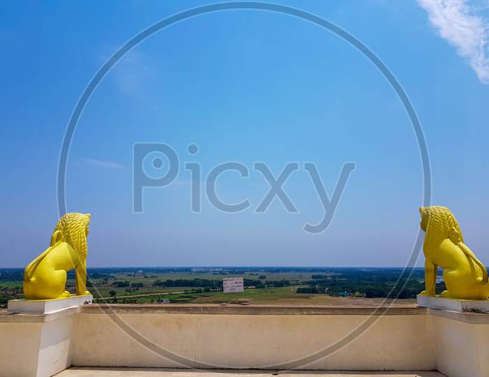 Skyline Of Odisa And Golden Lion Statues At Theview Point Of Dhauli Shanti Stupa At Odisha,India