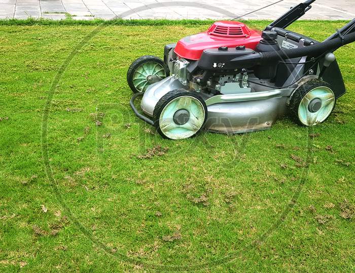 A Fully Automated Motorized Lawn Mower Clipping Grass On Lawn