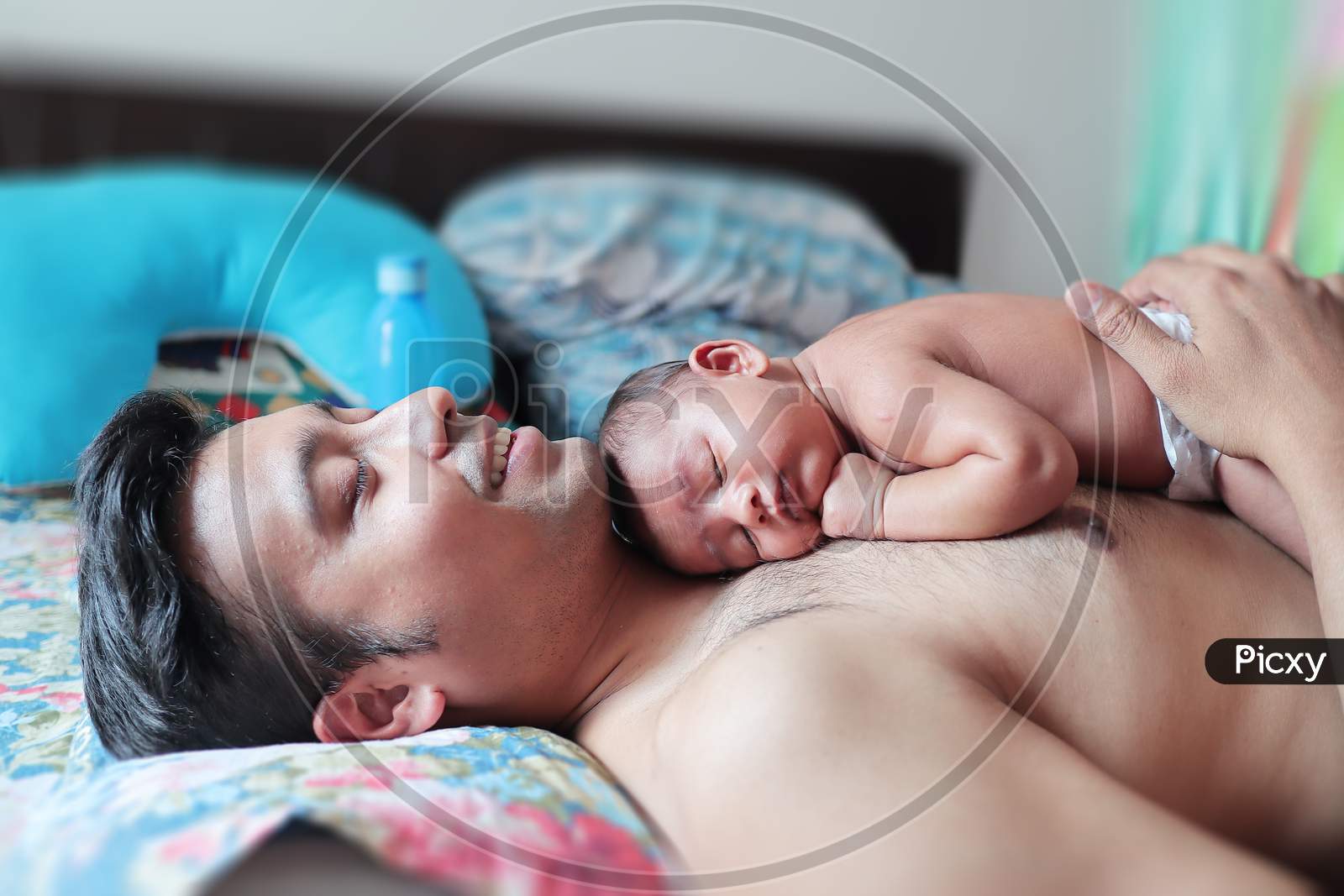 A Baby In Bare Body Peacefully Sleeping On The Body On His Father. Paternity Concept Parenting Photo.