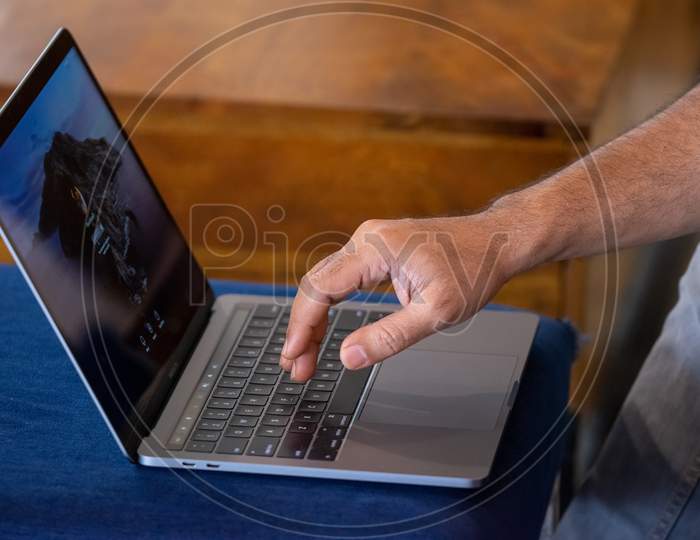 A man working with a laptop