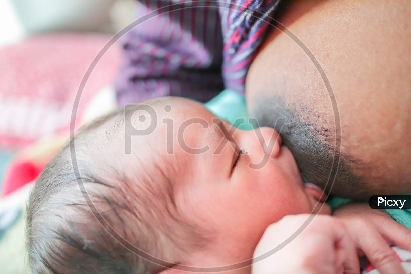 A Baby Breastfeeding From Mother'S Nipple With Eyes Closed. Exclusive Breast Feeding Concept Image