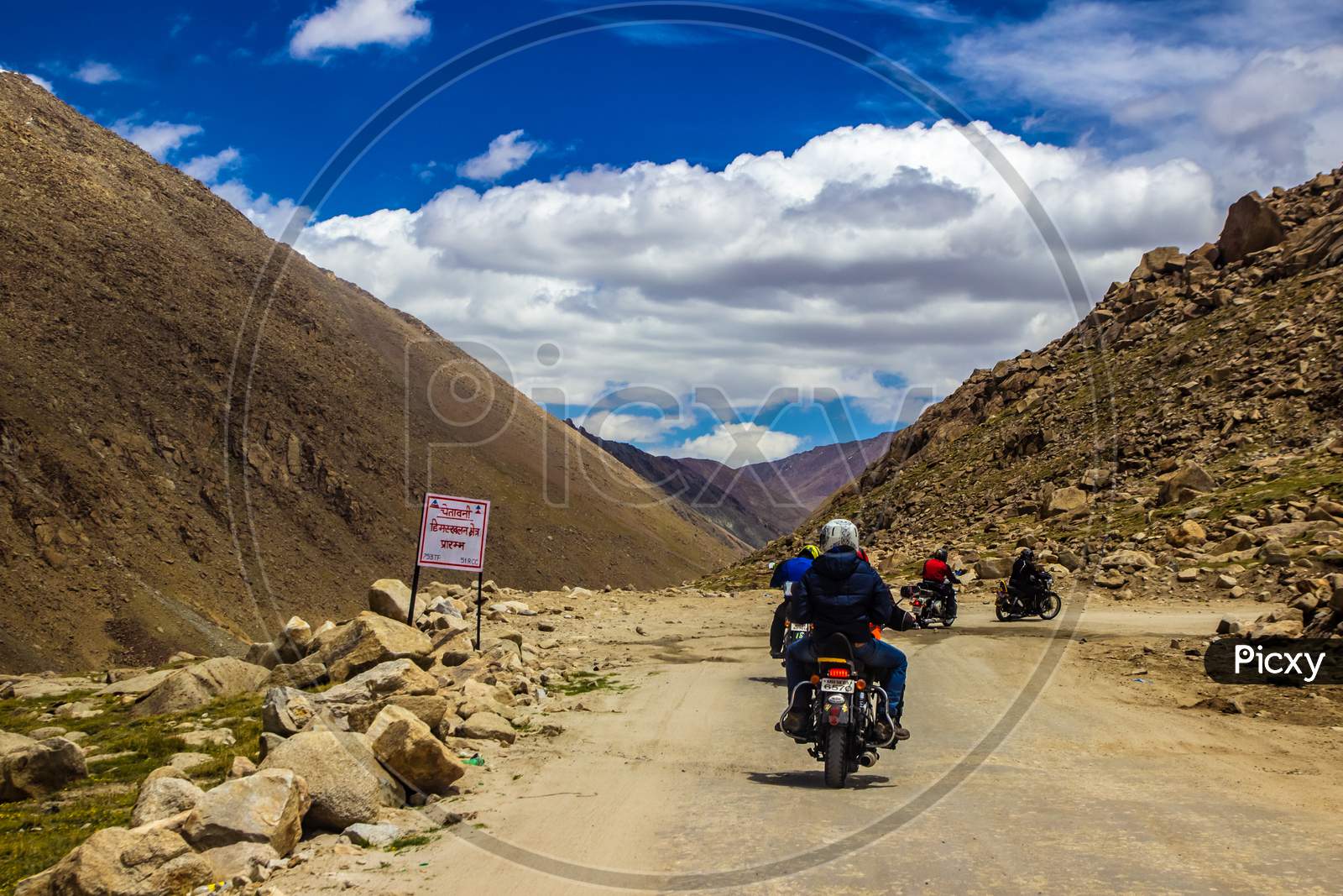 Ladakh,India.  Gang Of Bike Riders Riding Across Rocky Highway Of Ladakh, Kashmir, India
