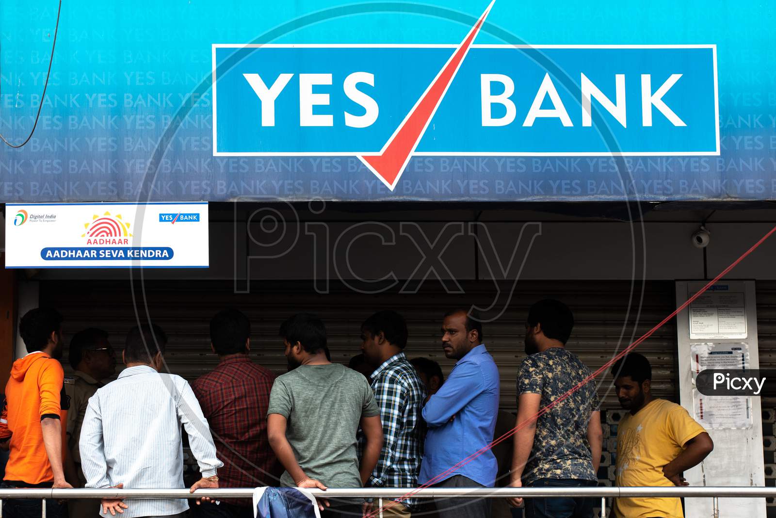 Customers line up in front of a closed Yes Bank,KPHB to withdraw their money due to the moratorium of Yes Bank by RBI