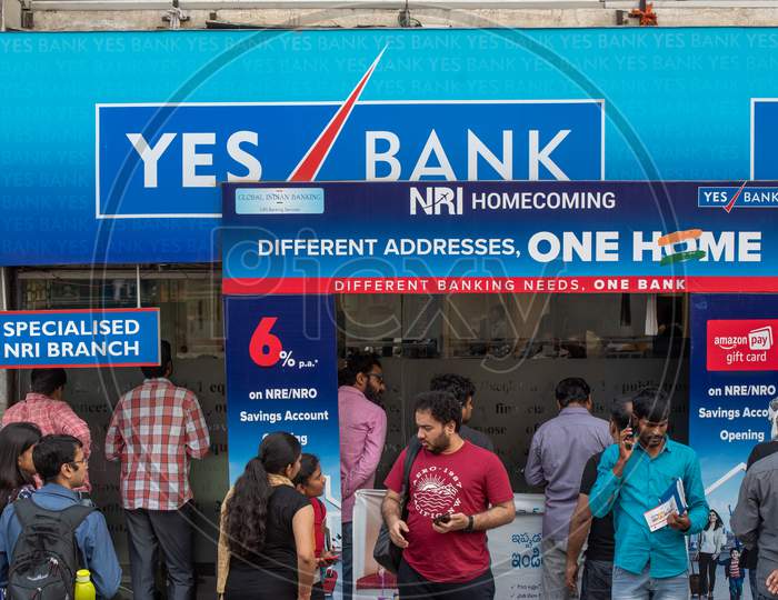 Customers line up in front of a closed Yes Bank,Madhapur to withdraw their money due to the moratorium of Yes Bank by RBI