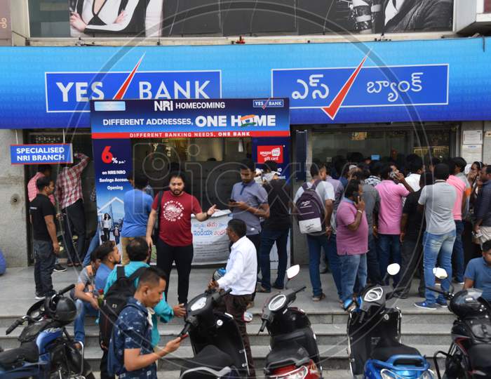 Customers line up in front of a closed Yes Bank,Madhapur to withdraw their money due to the moratorium of Yes Bank by RBI