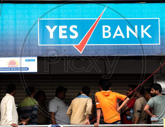 Customers line up in front of a closed Yes Bank,KPHB to withdraw their money due to the moratorium of Yes Bank by RBI