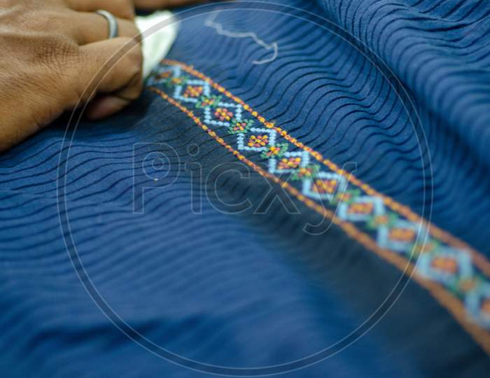 Clothes Or Textiles With Embroidery Design Closeup
