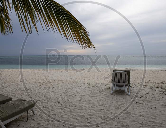 A Lone Chair In  a Beach