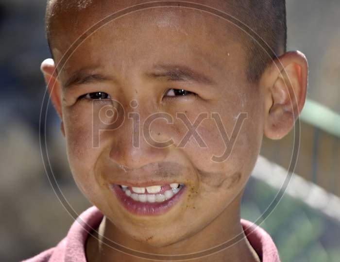 Portrait Of a Buddhist Monk Boy With Smiling Face  In Ladakh Buddhist Monasteries