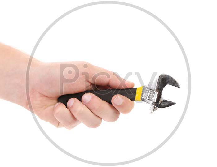 Hand Holding Adjustable Wrench. Isolated On A White Background.