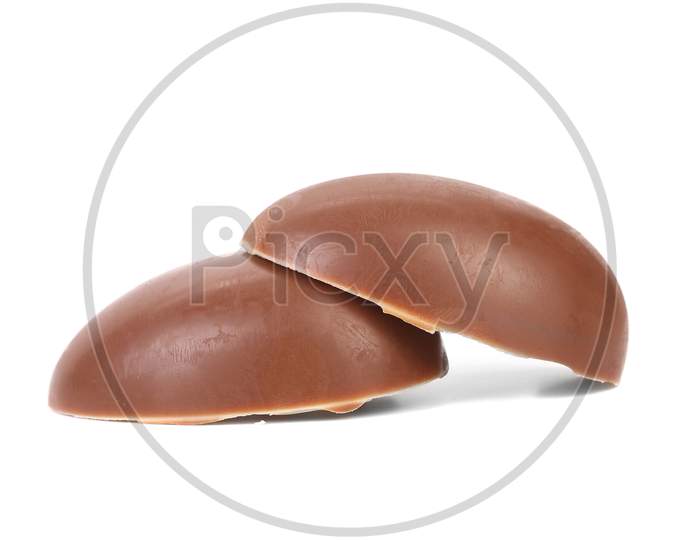 Two Halfs Of Chocolate Easter Egg. Isolated On A White Background.