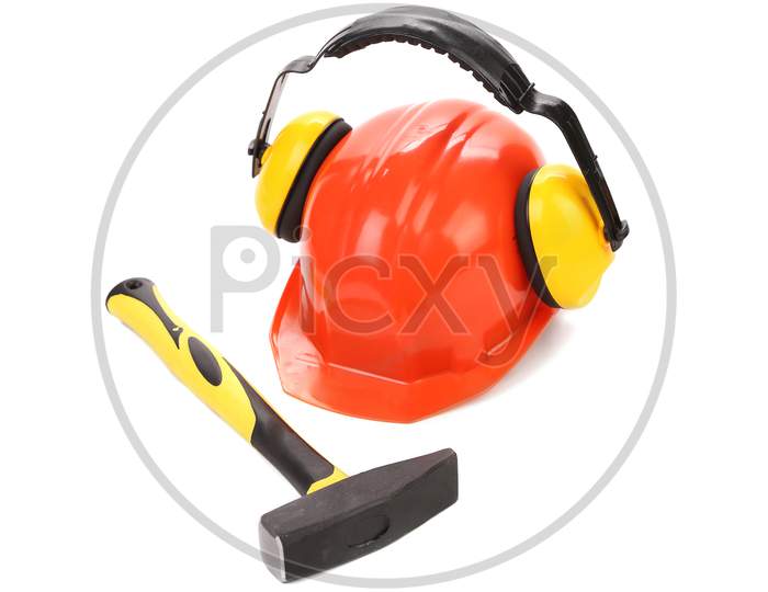 Ear Muffs On Hard Hat And Hammer. Isolated On A White Background.