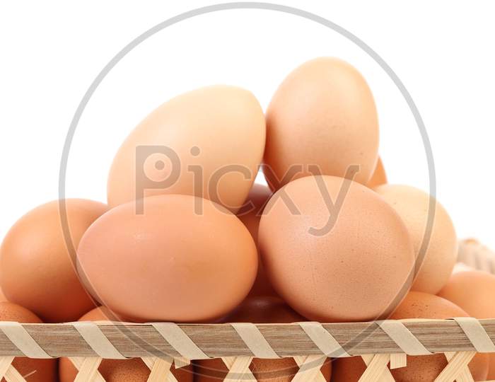 Close Up Of Eggs In Basket. Whole Background.