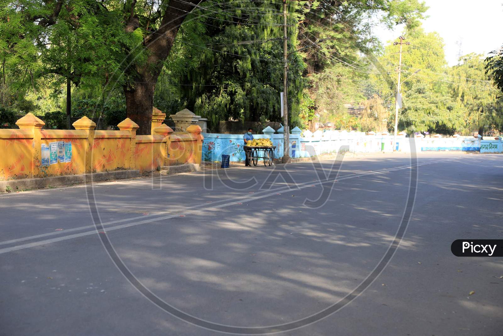 A Vendor Stand On The Empty Road  During Nationwide Lockdown In Wake Of Coronavirus Pandemic In Prayagraj, March 10, 2020.