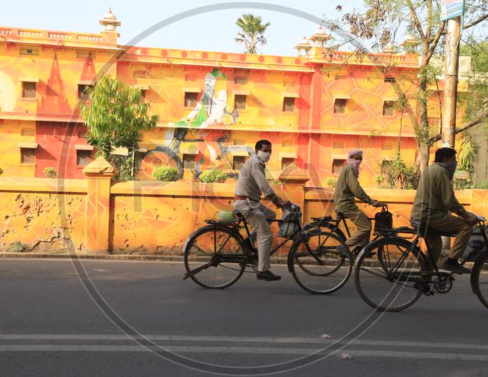 Sanitary Workers And  Security Man Riding On Bicycle To Home after Duty Hours During 21day Lock Down Due to Corona Virus Or COVID-19 Outbreak In India, Prayagraj