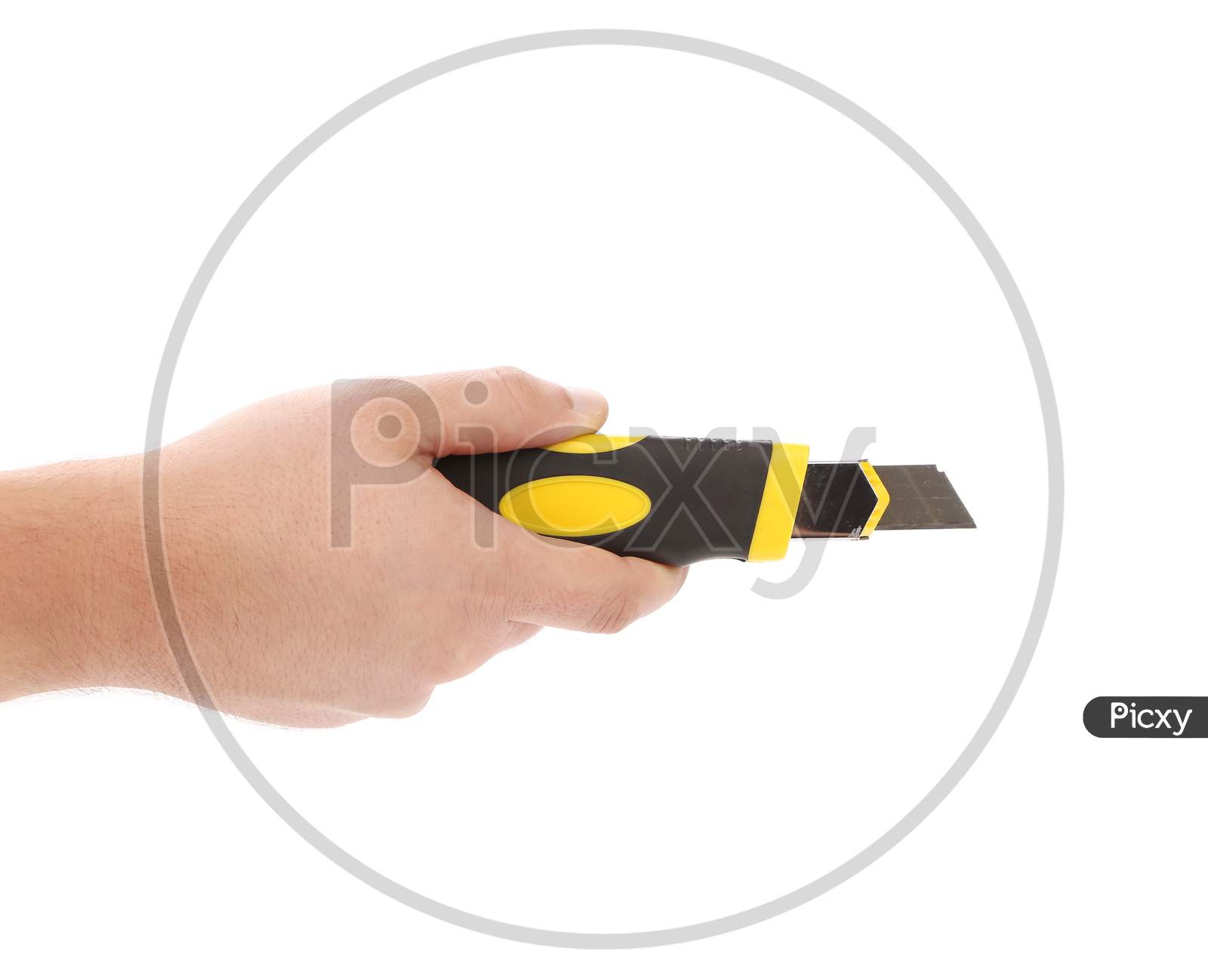 Hand Holds Yellow Stationery Knife. Isolated On White Background.