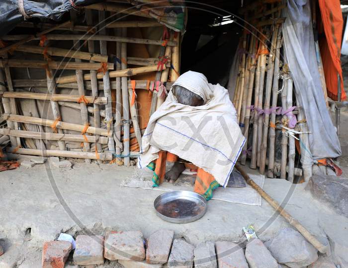 A Homeless Man Site Infront Of His Hut  During Nationwide Lockdown In Wake Of Coronavirus Pandemic In Prayagraj, March 10, 2020.