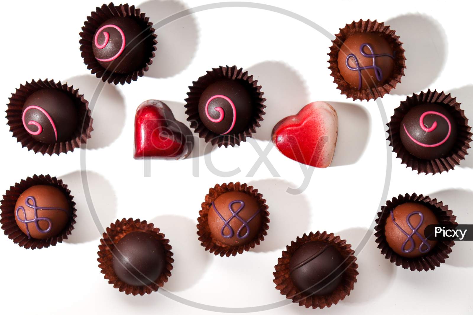 Variety Of Delicious Chocolate Pralines From Poland On A White Background.