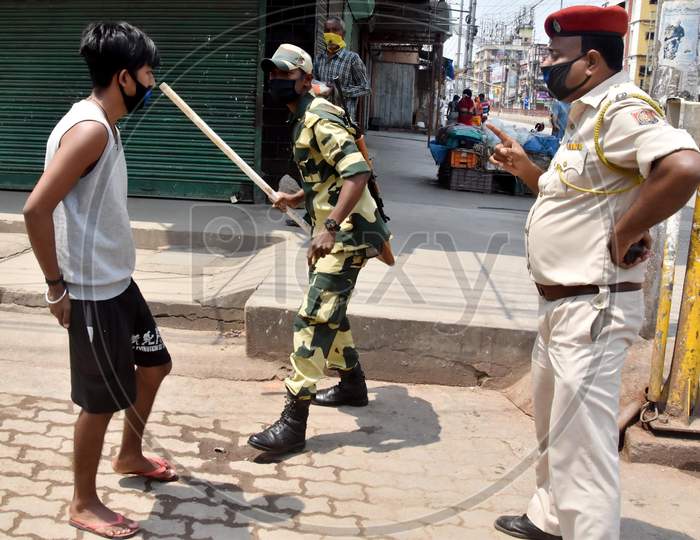 Guwahati - Security Personnel Punishes A Youth For Allegedly Flouting Lockdown, Imposed In The Wake Of Coronavirus Pandemic, In Guwahati Friday, April 10, 2020.