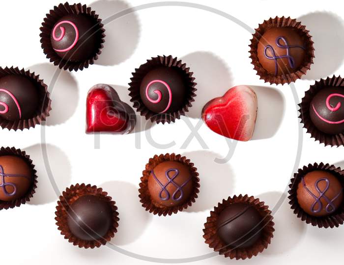 Variety Of Delicious Chocolate Pralines From Poland On A White Background.