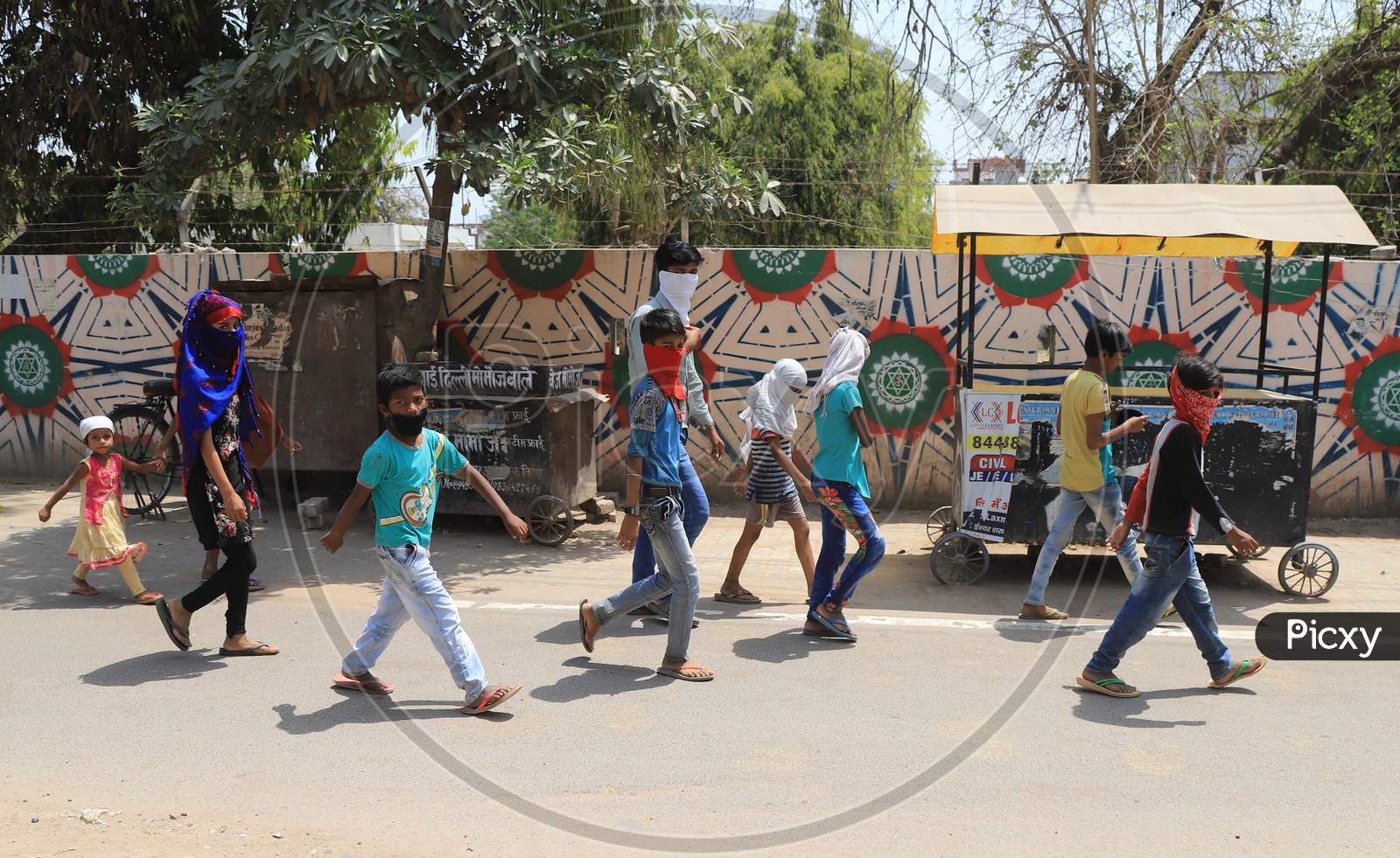 Children Arrive To Get Free Food Packets During A Government-Imposed Nationwide Lockdown As A Preventive Measure Against The Spread Of The Covid-19 Coronavirus In Prayagraj, April, 11, 2020.