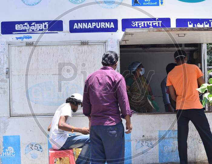 A migrant worker waits for food at a free food distribution centre, GHMC Annapurna, Madhapur amid nationwide lockdown due to coronavirus pandemic, April 10,2020, COVID19