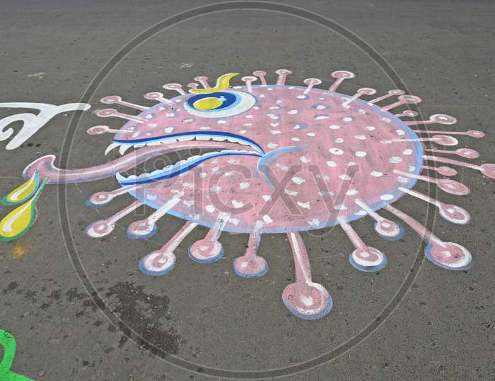 Slogans are painted on the road as part of a campaign to get people to comply with the lockdown to prevent coronavirus Covid-19 . At Burdwan Town, Purba Bardhaman District, West Bengal, India.