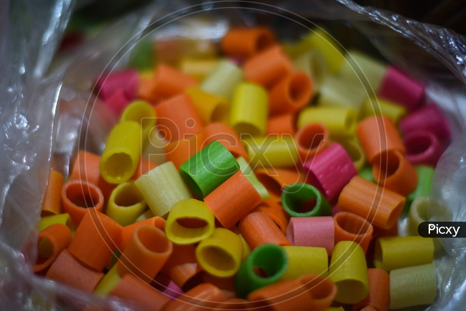 close up of colorful candies on bowl
