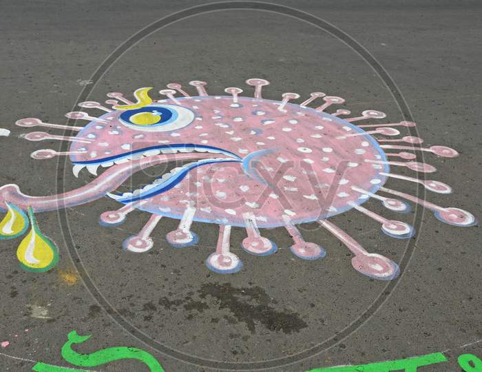 Slogans are painted on the road as part of a campaign to get people to comply with the lockdown to prevent coronavirus Covid-19. At Burdwan Town, Purba Bardhaman District, West Bengal, India.
