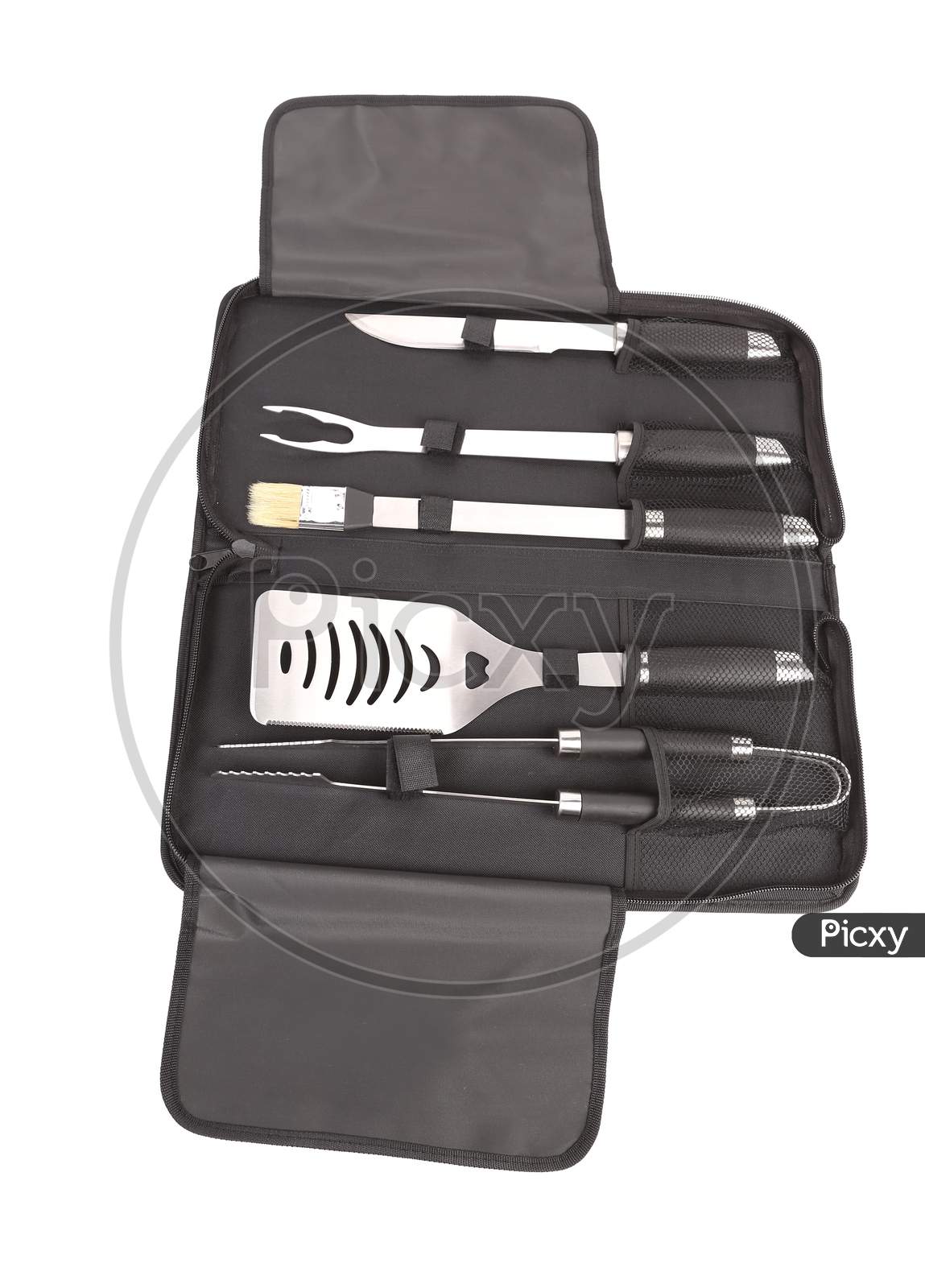 Set Of Tools For Bbq In Black Bag. Isolated On A White Background.