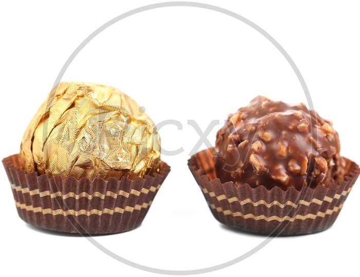 Close Up Of Chocolate Gold Bonbon. Isolated On A White Background.