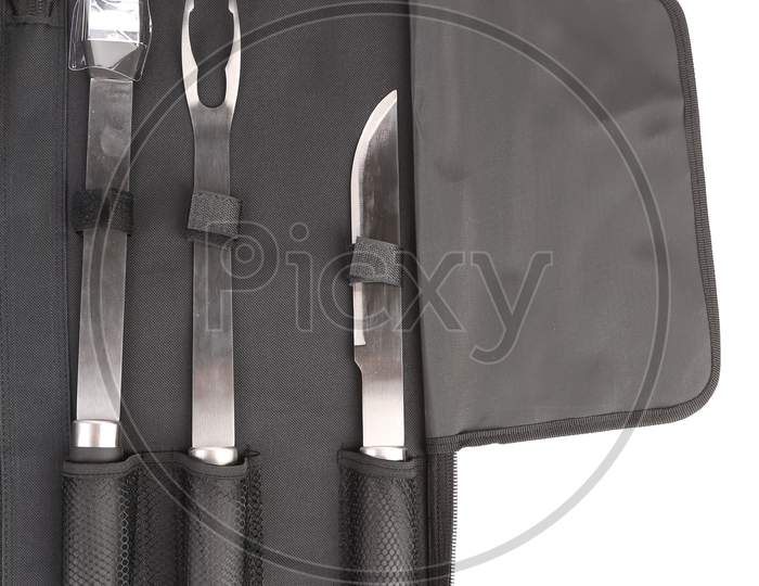 Set Of Tools For Bbq In Black Bag. Whole Background.