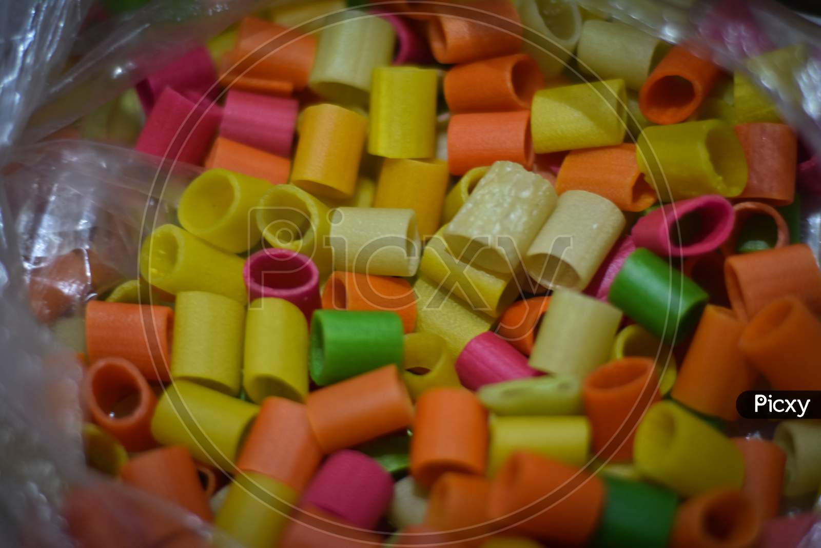 close up of colorful candies on bowl