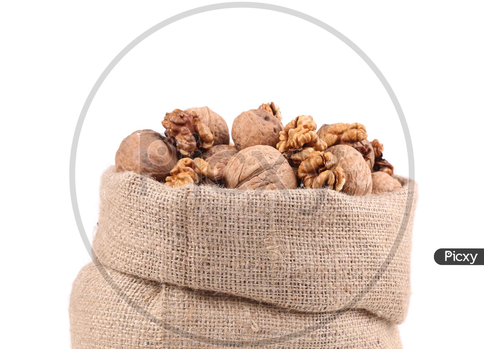Full Bag With Walnuts. Isolated On A White Background.