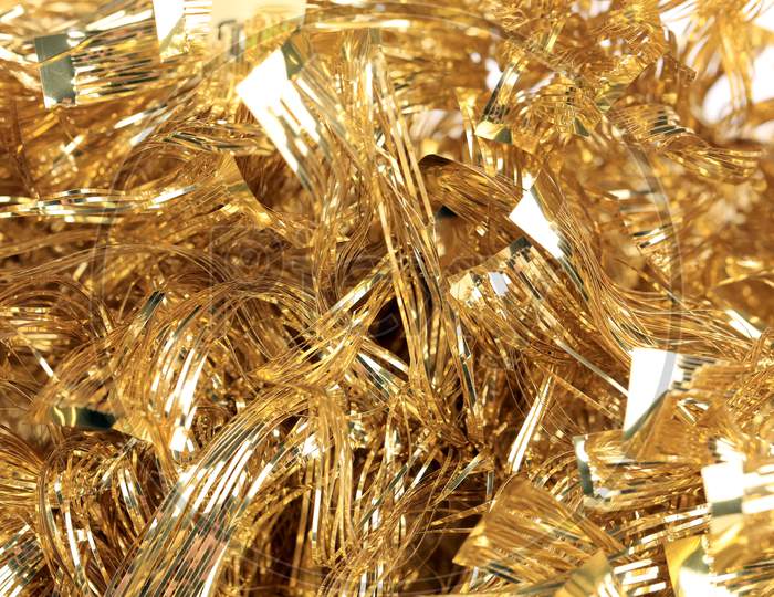 Christmas Golden Tinsel With Stars. Whole Background.