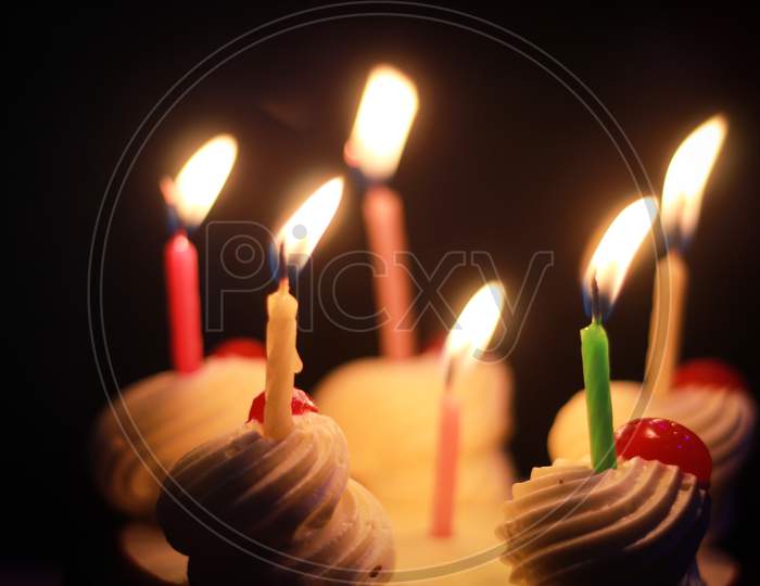 colorful birthday candles on a cake