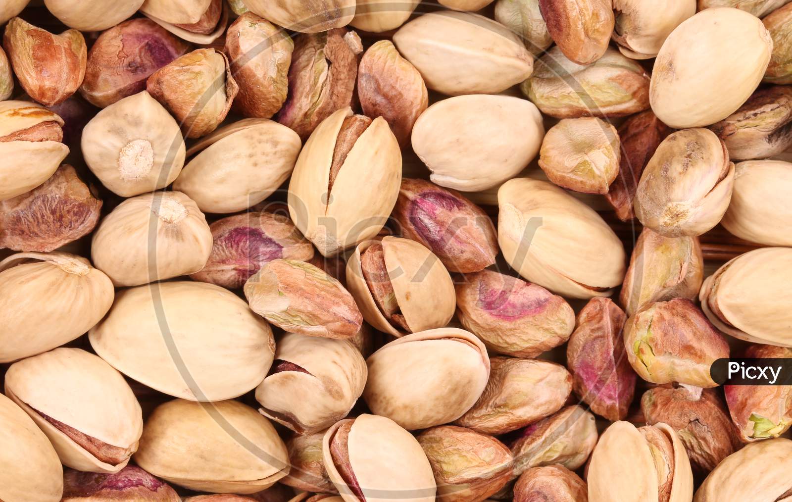 Close Up Of Many Pistachios. Whole Background.