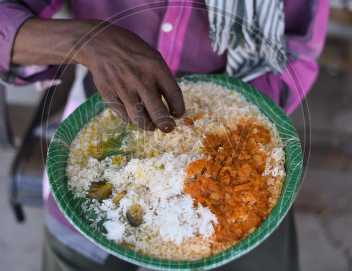 A migrant worker eats food at a free food distribution centre, GHMC Annapurna, Madhapur amid nationwide lockdown due to coronavirus pandemic, April 10,2020, COVID19