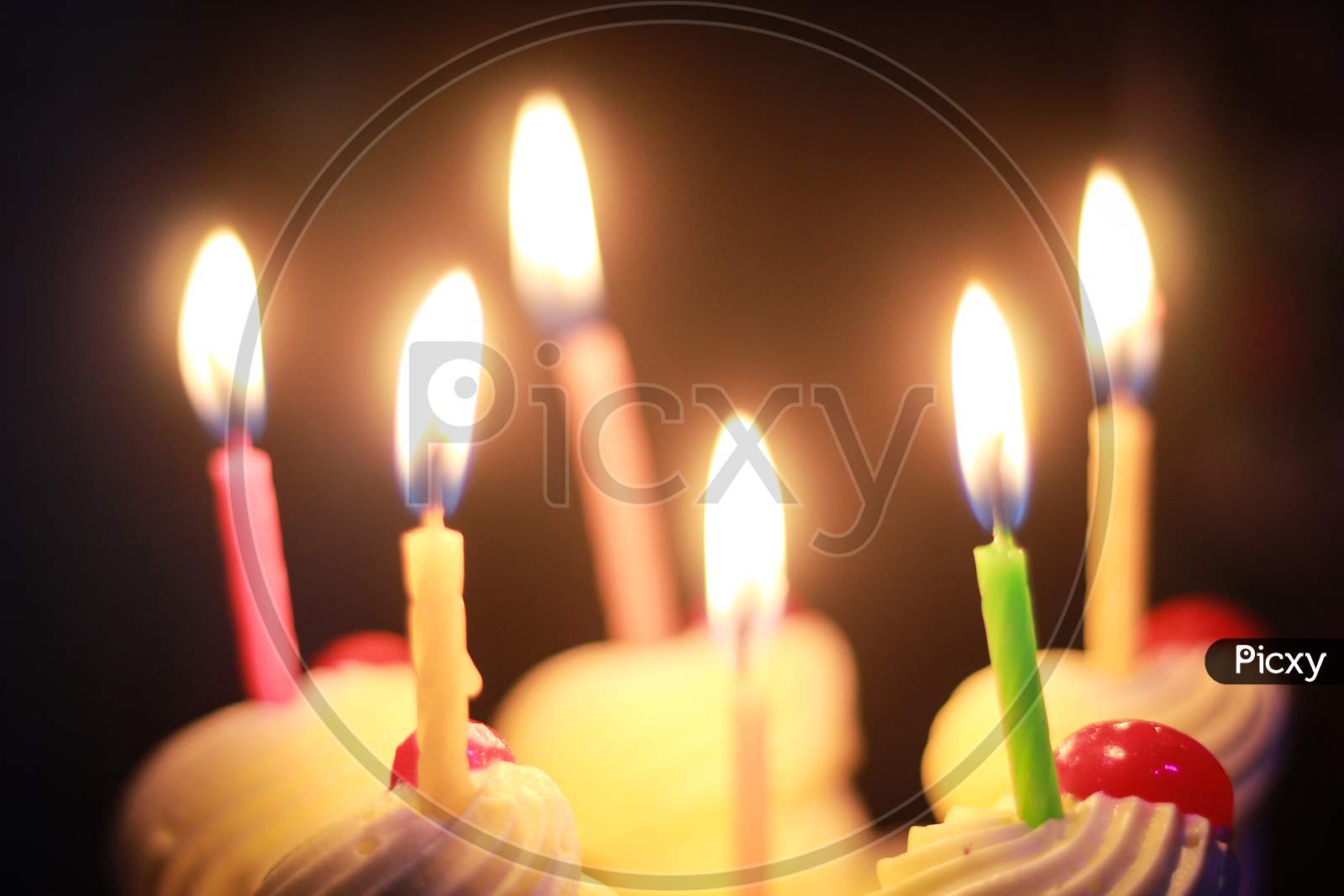 colorful birthday candles on a cake
