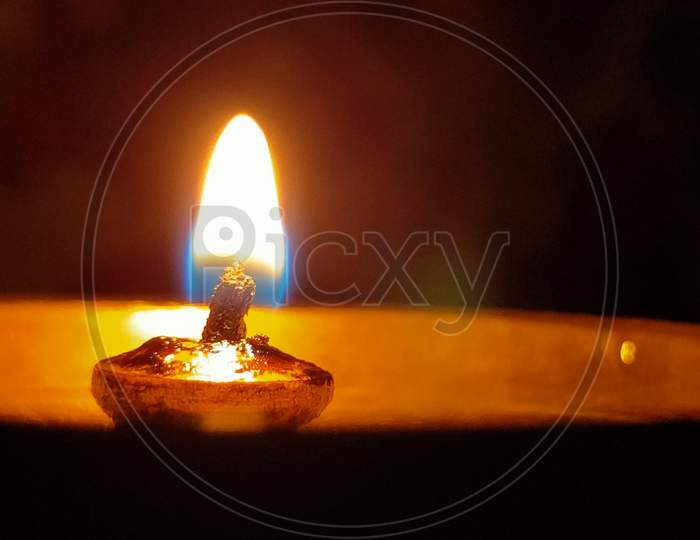 Diwali Dia Lit Over an Dark Black Background