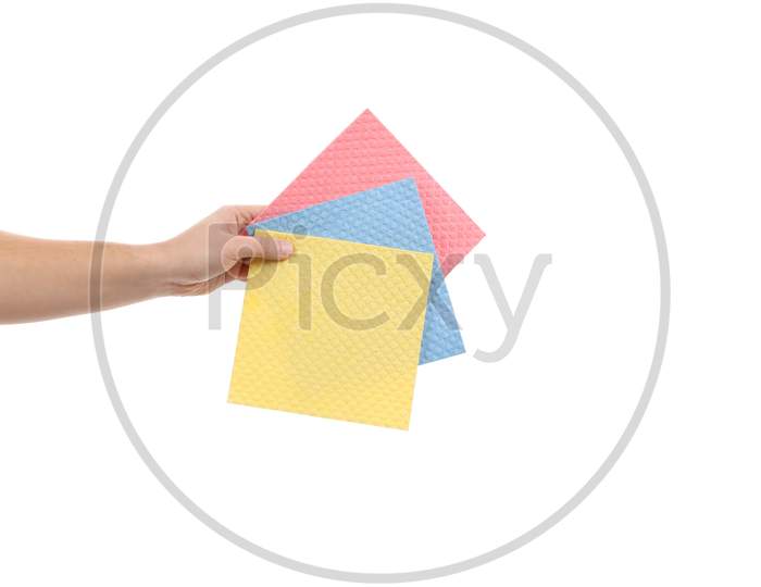 Hand Holds Different Sponges. Isolated On A White Background.