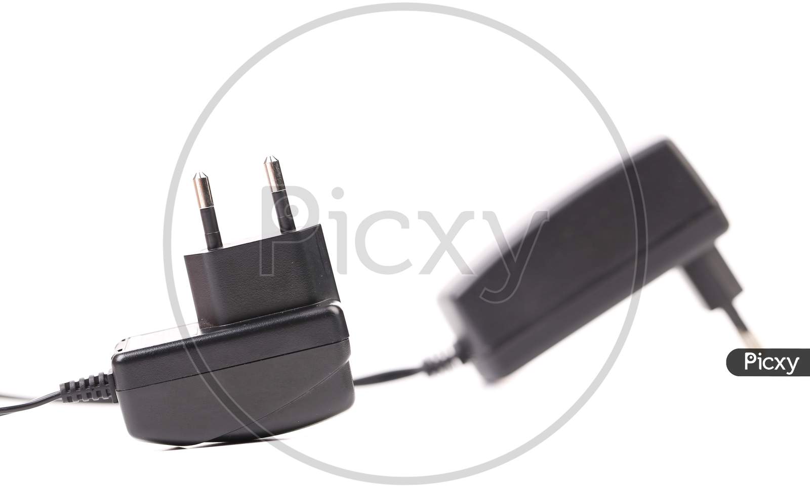 Two Electric Power Adapters. Close Up. Isolated On A White Background.