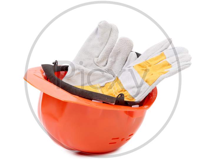 Red Hard Hat With Leather Gloves. Isolated On A White Background.
