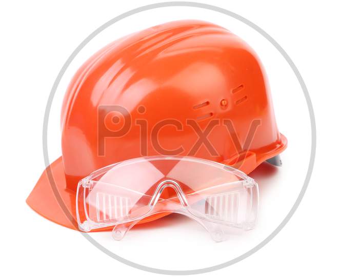 Red Hard Hat And Glasses. Isolated On A White Background.