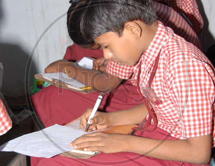 Indian School Children  Reading In an Classroom