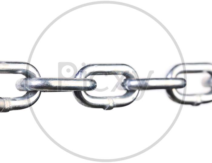 Close Up Of Links A Chain. Isolated On A White Background.